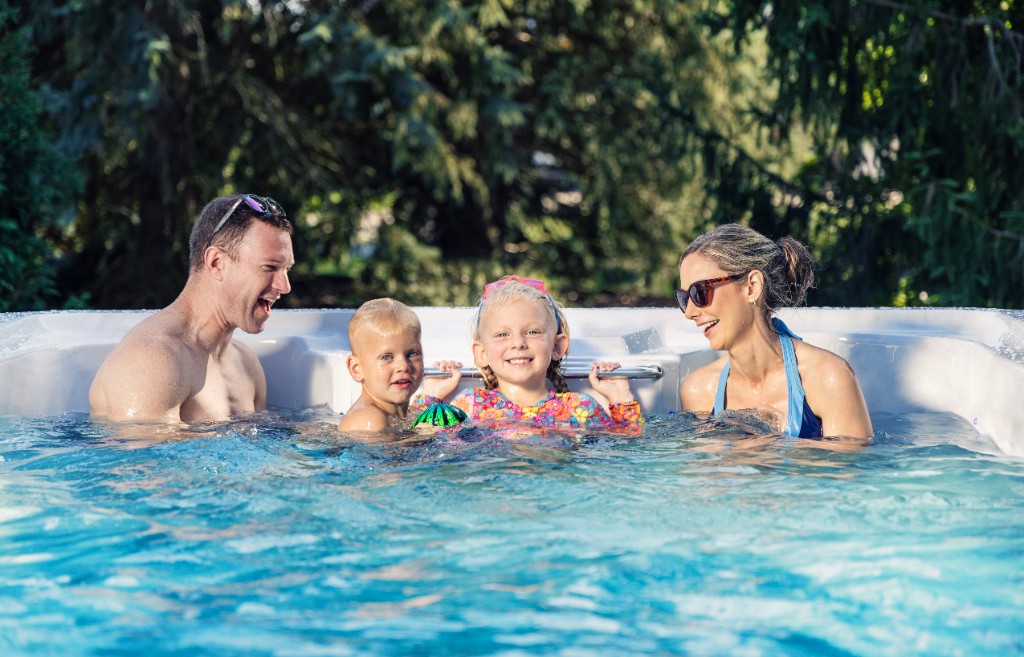 A family enjoying a Master Spas swim spa
